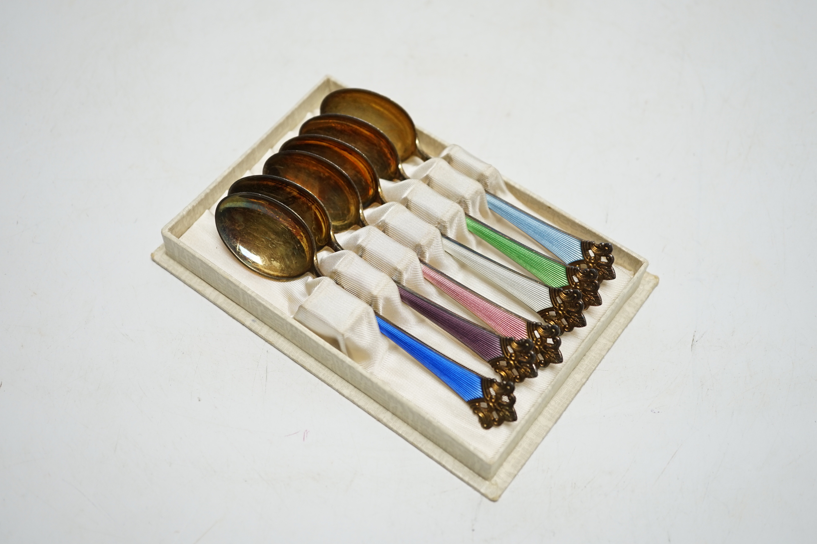 A cased set of six Norwegian gilt sterling and polychrome enamel teaspoons, 11.1cm.